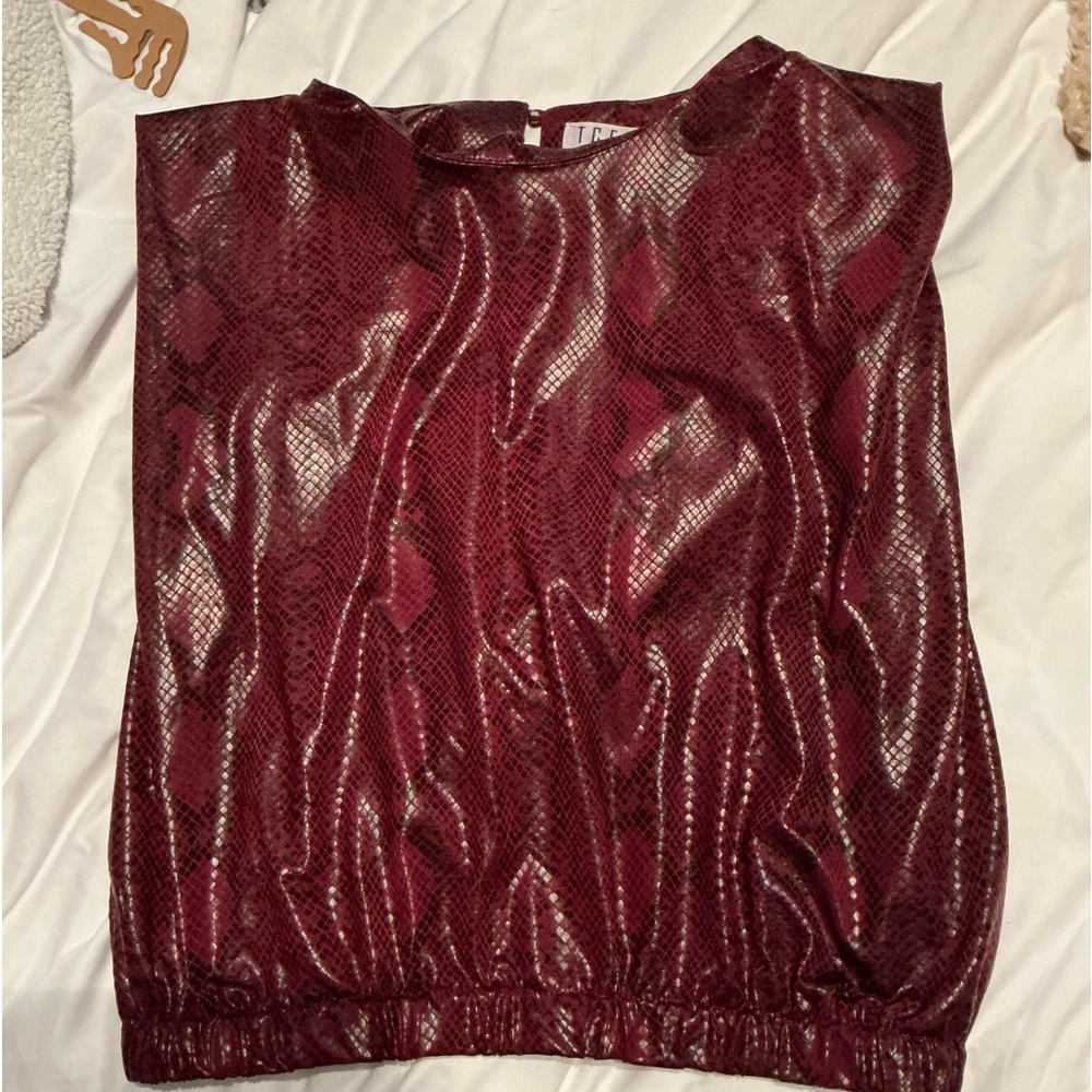 Maroon shoulder pad snake skin top